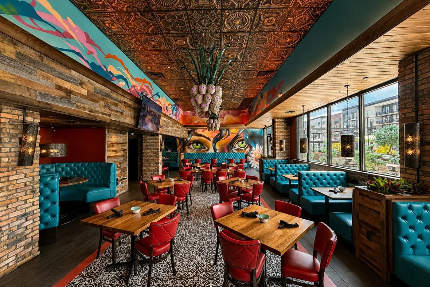 Dining room at Agave Bandido, under the painted eyes and the skull chandelier