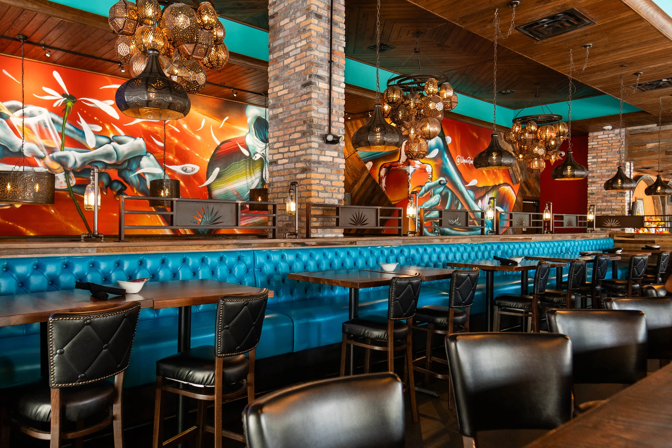 The bar at Agave Bandido, under the painted murals