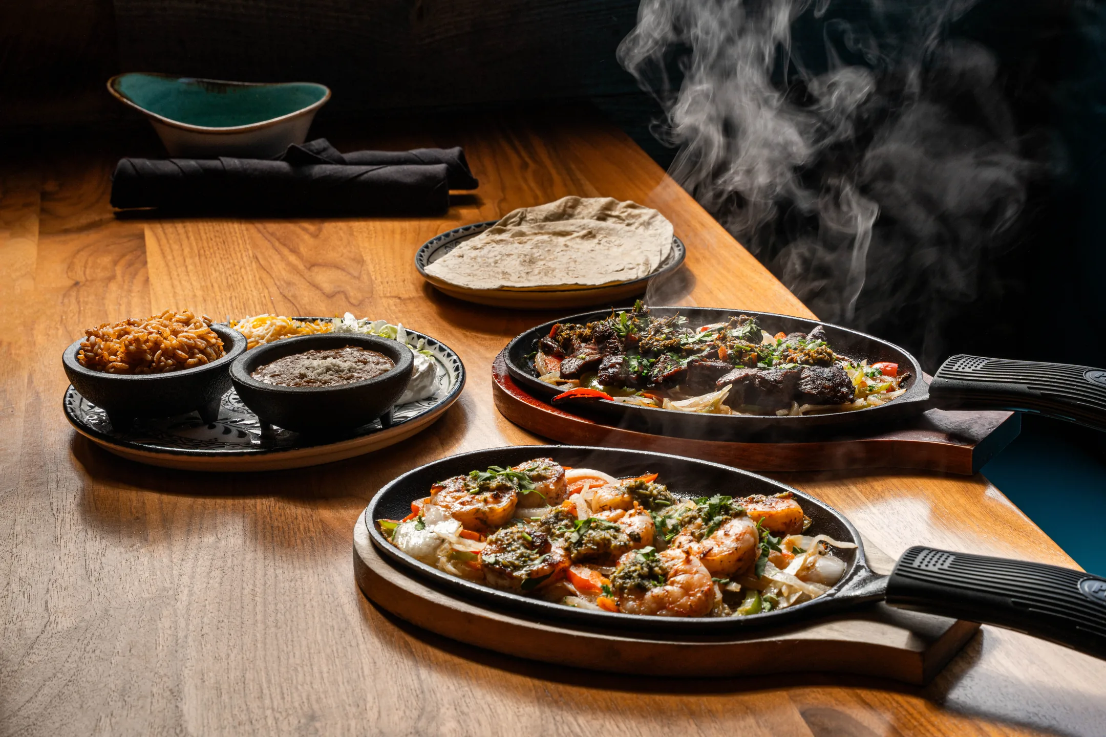 Fajitas coming out of the kitchen, still steaming
