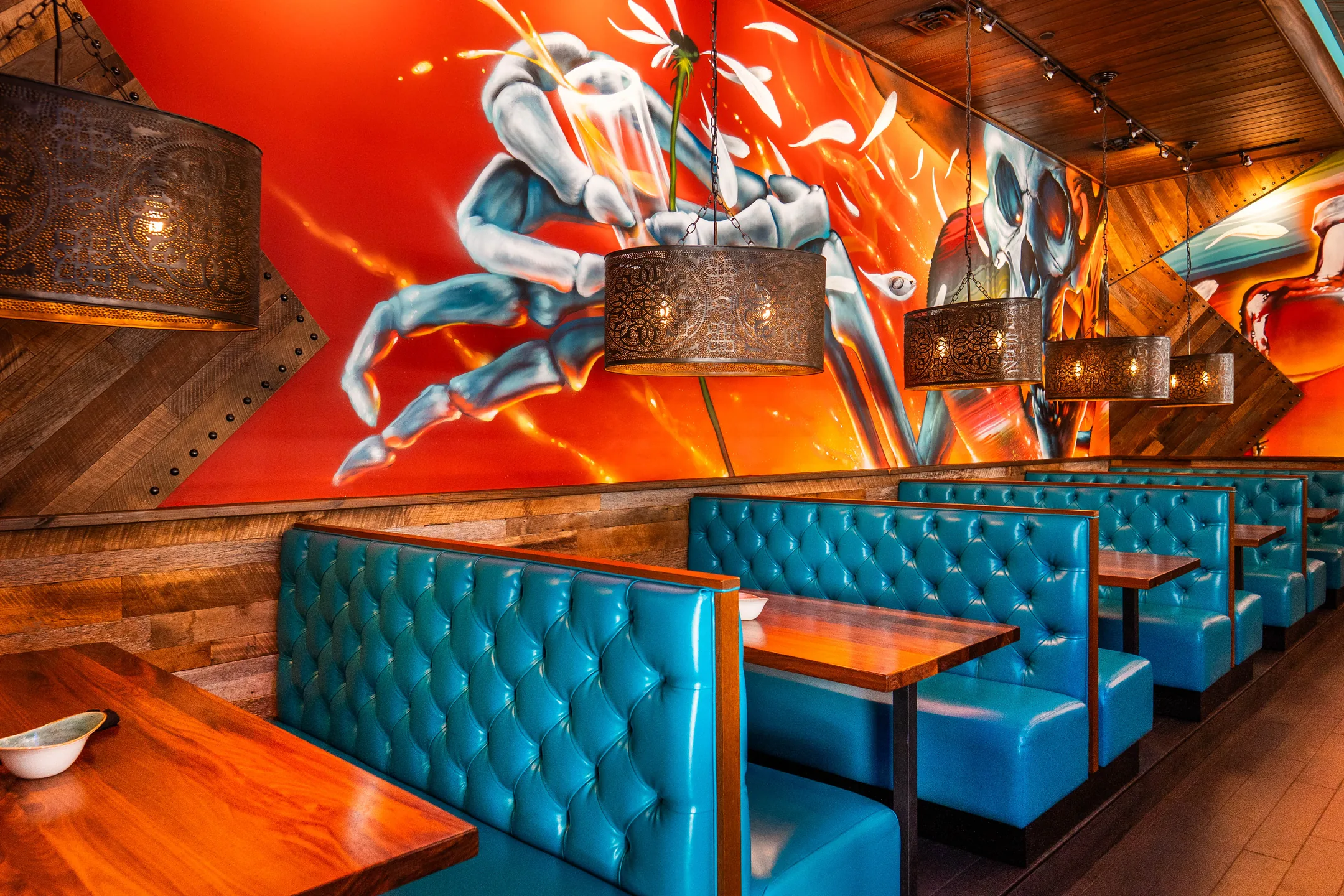 The booths at Agave Bandido, under the mural wall